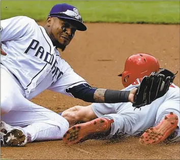  ?? Alex Gallardo Associated Press ?? THE SALE of Fox Sports’ 22 regional networks, which have been valued at $22 billion, is the biggest sports media auction in decades. Above, Erick Aybar, shortstop for the San Diego Padres, makes a play last year.