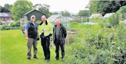  ??  ?? ●● Coun Kevin Hoines, Supervisor Ron Shaw and Coun Mike Horrox at the cleaned-up allotment
