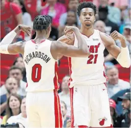  ?? WILFREDO LEE/AP ?? Hassan Whiteside (21) and guard Josh Richardson, seen flexing during a game last season, rate as two of the best former Heat players found on current NBA rosters.