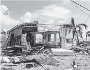  ??  ?? Debris surrounds a destroyed structure in the aftermath of Hurricane Irma in Big Pine Key, Fla.