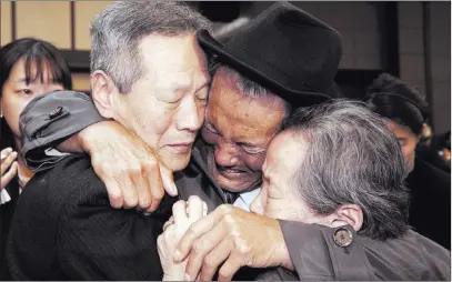  ??  ?? The Associated Press Son Kwon Geun, of North Korea, center, weeps with his South Korean relatives after 2015’s separated family reunion meeting at Diamond Mountain resort in North Korea. South Korea’s Red Cross said Monday it wants talks to discuss...