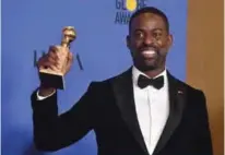  ??  ?? Actor Sterling K Brown poses with the trophy for Best Performanc­e by an Actor In A Television Series - Drama.