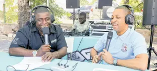  ?? ?? Robin Levy (right), JCCUL Group CEO, shares his excitement in an outside broadcast with Burgerman and the Edge105.3 about the ‘Access Di Access + Brawta’ campaign promotion and the successful partnershi­p between credit unions and Mastercard.