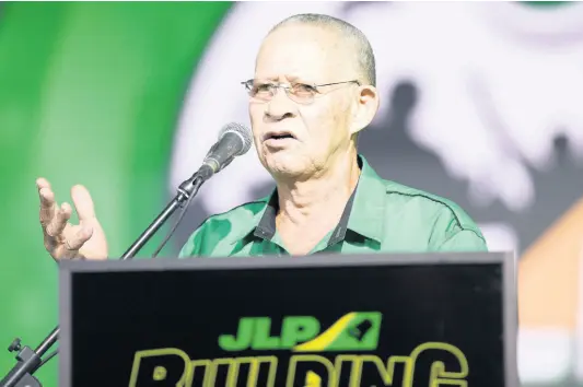  ?? GLADSTONE TAYLOR//MULTIMEDIA PHOTO EDITOR ?? Former Prime Minister Bruce Golding addresses Jamaica Labour Party supporters during the party’s annual conference, held at the National Arena on Sunday.