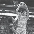  ??  ?? Phoenix Mercury center Brittney Griner shoots a jumper against the New York Liberty in the first half on Friday night in Phoenix.