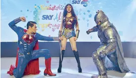  ??  ?? Cosplayers as Batman, Superman and Wonder Woman characters during the Sky Alive