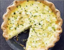  ?? DANIEL J. VAN ACKERE — AMERICA’S TEST KITCHEN VIA AP ?? This undated photo provided by America’s Test Kitchen in October 2018 shows a leek and goat cheese quiche in Brookline, Mass. This recipe appears in the cookbook “ATB Brunch.”