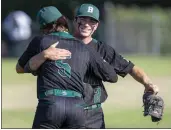  ?? PHOTO BY ALEX GALLARDO ?? Bonita pitcher Garrett Patterson, right, celebrates with left fielder Jared Brunk after defeating Damien 6-1on Friday.