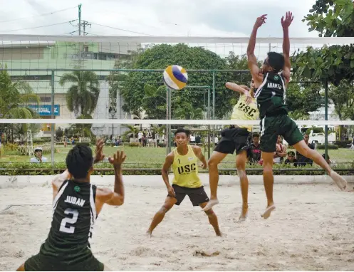  ?? SUNSTAR FOTO / ARNI ACLAO ?? STRAIGHT SETS. After opening with a grand slam in basketball, the University of the Visayas caps its Cesafi season with another grand slam in men’s beach volleyball.