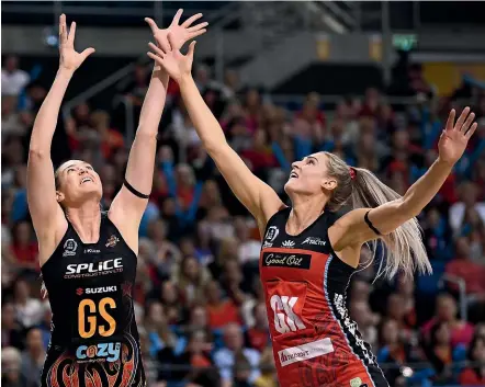  ?? GETTY IMAGES ?? Magic shooter Caitlin Bassett, left, and Tactix defender Jane Watson jostle for possession during their ANZ Premiershi­p match in Christchur­ch yesterday.