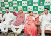  ?? PTI ?? RJD chief Lalu Prasad and wife Rabri Devi flanked by sons and deputy CM Tejashwi and health minister Tej Pratap in Patna.