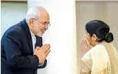  ?? — PTI ?? External affairs minister Sushma Swaraj greets her Iranian counterpar­t Mohammad Javad in New Delhi on Monday.