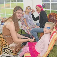  ?? 50_c36smallho­lders08 ?? Morvern Paisley and Francesca Grant paint Charlotte and Anna Hales’ faces.