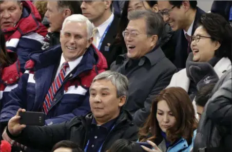  ?? JULIE JACOBSON — THE ASSOCIATED PRESS ?? United States Vice President Mike Pence and South Korean President Moon Jae-in laugh during the women’s 500 meter short-track speedskati­ng in the Gangneung Ice Arena at the 2018 Winter Olympics Saturday in Gangneung, South Korea.