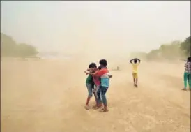  ?? ARUN SHARMA/HT PHOTO ?? Children enjoy the change in weather on Saturday evening. On Sunday, the mercury is expected to drop to 26° Celsius in the morning and rise up to 39° Celsius during the day.