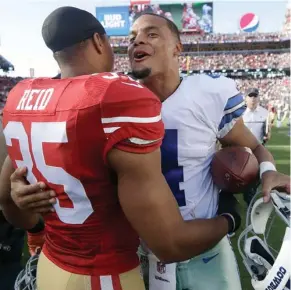  ?? Marcio Jose Sanchez, AP) (Photo by ?? Former Mississipp­i State quarterbac­k Dak Prescott, right, of the Dallas Cowboys gets a hug from San Francisco 49ers safety Eric Reid (35) after last Sunday's game.