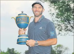  ??  ?? Dustin Johnson con el trofeo del WGC de Mexico, que ya ganara en 2015 y 2017 GETTY