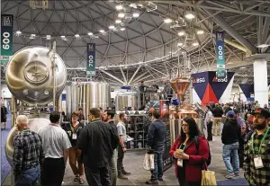  ?? DAVID JOLES / MINNEAPOLI­S STAR TRIBUNE ?? A big crowd attended the national Craft Brewers Conference at the Minneapoli­s Convention Center on Tuesday.