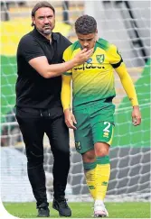 ??  ?? Norwich boss Daniel Farke consoles defender Max Aarons at the final whistle