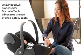  ??  ?? UNDP goodwill ambassador Michelle Yeoh advocates the use of child-safety seats.