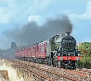  ?? JOHN STRETTON ?? Lit by glorious summer sunshine, No. 45596 Bahamas storms through Ashchurch on August 27, with 1Z55, the 16.33 Worcester Shrub Hill to London Paddington returning ‘The Cotswold Venturer’ excursion for the Railway Touring Company.