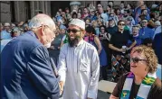  ?? TAMIR KALIFA/ AMERICAN-STATESMAN ?? Retired Bishop Joel Martinez and Mufti Mohamed-Umer Esmail (center) attend a rally at the Capitol on Tuesday to protest what they call discrimina­tory legislatio­n against transgende­r people.