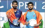  ?? PTI ?? B Sai Praneeth (R) and runner-up Kidambi Srikanth both from India pose with their tropies in Singapore on Sunday.