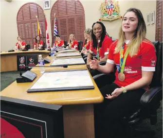  ??  ?? Hannah Darling speaks as the Canadian Olympic bronze-medallist women’s rugby team was honoured in the Langford city council chambers on Monday.