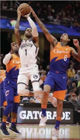  ?? TONY DEJAK — THE ASSOCIATED PRESS ?? The Nets’ D’Angelo Russell drives to the basket against Jordan Clarkson on Feb. 13 at Quicken Loans Arena.