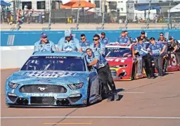  ?? PETER CASEY/USA TODAY SPORTS ?? Kevin Harvick's No. 4 and other cars are pushed to the grid ahead of qualifying for the 2021 NASCAR Cup Series championsh­ip race.