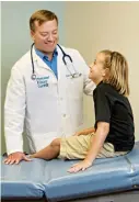  ??  ?? Pediatrici­an Dr. R. Nathan Landefeld and patient