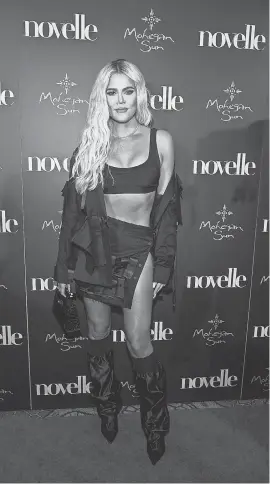  ?? DAVE KOTINSKY/ GETTY IMAGES ?? Khloe Kardashian walks the red carpet at the grand opening of Mohegan Sun’s novelle in Uncasville, Conn., in 2019. The reality star has acknowledg­ed her struggles with body image.