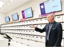  ?? ALY THOMSON/THE CANADIAN PRESS ?? Nova Scotia Liquor Corp. head Bret Mitchell unveils the liquor store’s pot section in Halifax on Wednesday.