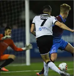  ??  ?? Michael Duffy slots home the third goal.