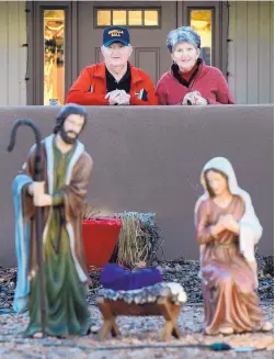  ?? GREG SORBER/JOURNAL ?? Russ and Phylis Thorson say their Nativity scene was stolen Dec. 8 from their home near Spain and Moon NE and returned four nights later, along with an apology note.