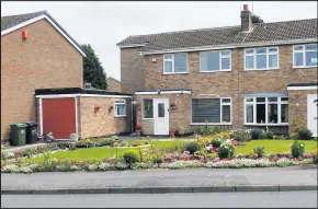  ??  ?? ■ The adjoining front gardens of Kanji and Parvati Chauhan and Philip and Wendy Moore, local residents inspired by Bloom, on Sandringha­m Drive.