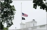  ?? SUSAN WALSH — THE ASSOCIATED PRESS ?? The American flag flies at half-staff at the White House in Washington, Thursday, as the Biden administra­tion commemorat­es 1million American lives lost due to COVID-19.