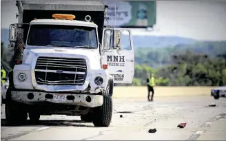  ?? JIM NOELKER / STAFF ?? This dump truck was involved in a multi-vehicle fatal chain-reaction accident on July 27 on Interstate 75 north in Moraine. Through Tuesday, 718 people have been killed on Ohio roads.