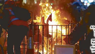  ?? REUTERS ?? A barricade on fire is pictured during a protest near Mong Kok police station in Hong Kong yesterday.