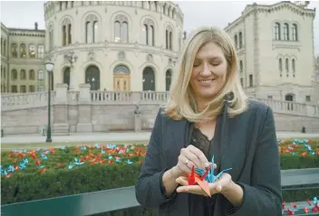  ?? AP FOTO ?? PEACE, HOPES. Nobel Peace Prize laureate Beatrice Fihn, executive director of the Internatio­nal Campaign to Sbolish Nuclear Weapons holds paper cranes, a peace symbol that originated in Hiroshima, the site of the first atomic bomb attack.