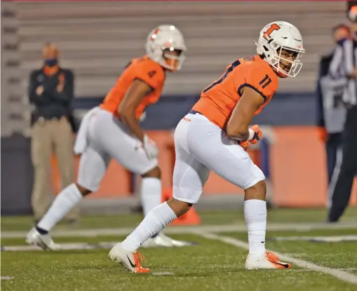  ?? MICHAEL ALLIO/AP ?? Illinois, including receivers Carlos Sandy (11) and Khmari Thompson, will host Nebraska at noon Saturday to kick off the college football season.