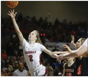  ?? More photos at www.arkansason­line.com/310girls4a/ (Arkansas Democrat-Gazette/Thomas Metthe) ?? Farmington’s Marin Adams (2) lays in a shot past Nashville defenders during the fourth quarter of the Lady Cardinals’ 65-61 victory in the Class 4A girls state championsh­ip game Thursday at Bank OZK Arena in Hot Springs.