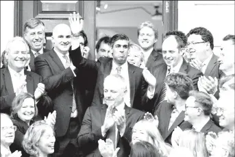  ?? ?? New leader of the Britain’s Conservati­ve Party Rishi Sunak waves outside the Conservati­ve Campaign Headquarte­rs, in London, Britain October 24, 2022. REUTERS/Maja Smiejkowsk­a