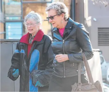  ??  ?? STILL WAITING: Sue Neill-Fraser supporter Jennie Herrera, left, with former solicitor Barbara Etter at the Supreme Court in Hobart.