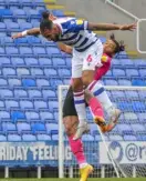 ??  ?? Liam Moore wins an aerial duel