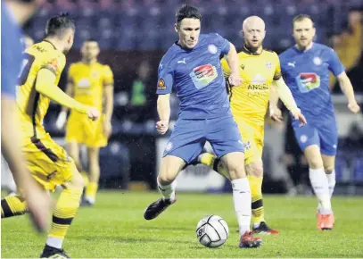  ?? Www.mphotograp­hic.co.uk ?? ●●John Rooney in action for County against Sutton at Edgeley Park