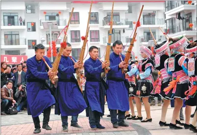  ?? TAO LIANG / XINHUA ?? Local residents celebrate Spring Festival last year at their newly relocated homes in Huishui county, Guizhou’s Qiannan Bouyei and Miao autonomous prefecture, part of local government’s effort towards poverty alleviatio­n.