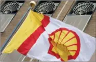  ?? PETER DEJONG — THE ASSOCIATED PRESS FILE ?? Royal Dutch Shell’s $82billion purchase of gas company BG Group will boost its oil and gas reserves by 25percent and give it a bigger presence in the fast-growing liquefied natural gas market.