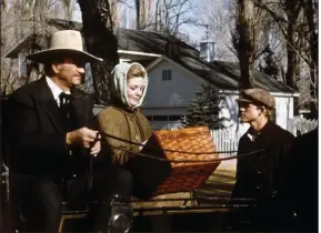  ??  ?? Lauren Bacall and a young Ron Howard star with “The Duke” (John Wayne) in “The Shootist” (1976).
