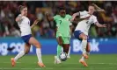  ?? Fifa/Getty Images ?? Toni Payne holds off Georgia Stanway (left) and Keira Walsh on a difficult night for the England midfield duo. Photograph: Elsa/